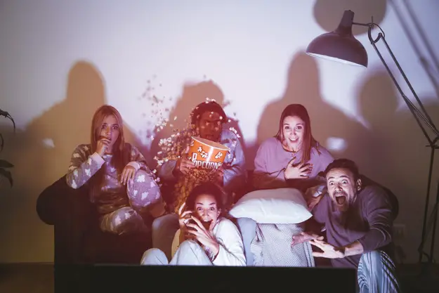 Five friends watching a movie together